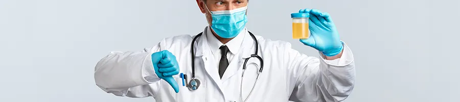 Doctor giving a thumbs down to a urine sample