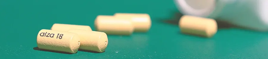 Spilled concerta pills on a green table
