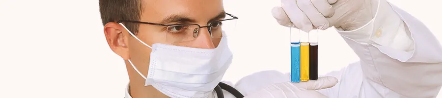 A person holding up three different test tubes